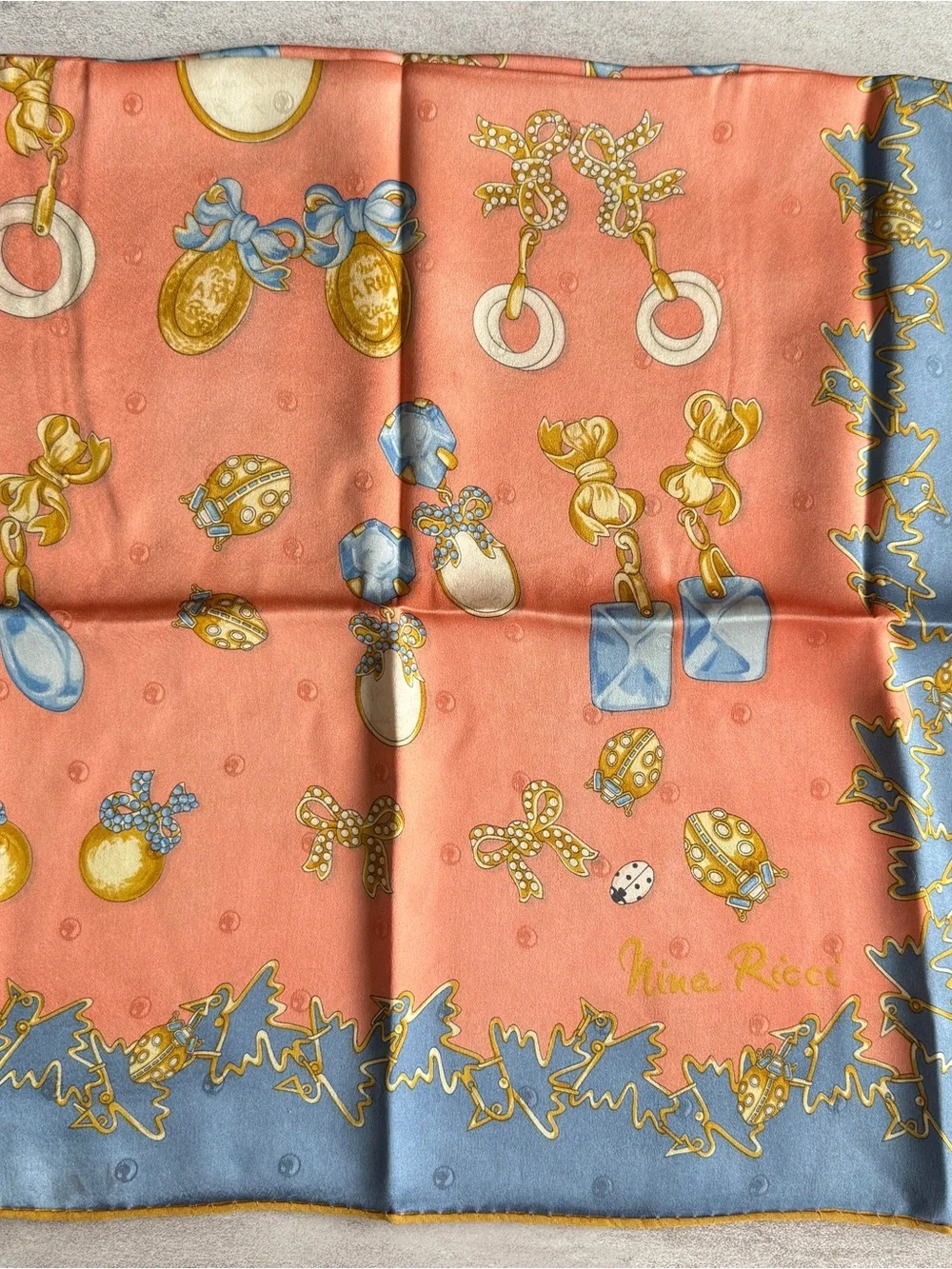 Nina Ricci Coral Scarf with Blue and Gold Jewelry Motifs